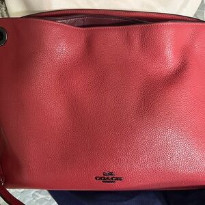 Coach salmon/pink colored purse. Has long strap too.